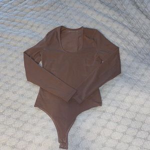 Light brown long sleeve Abercrombie body suit size small.